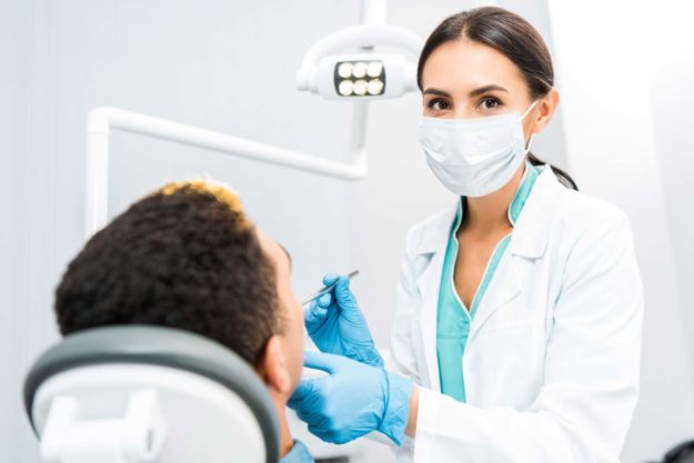 what-are-general-dentistry-services dentist performing general dentistry services