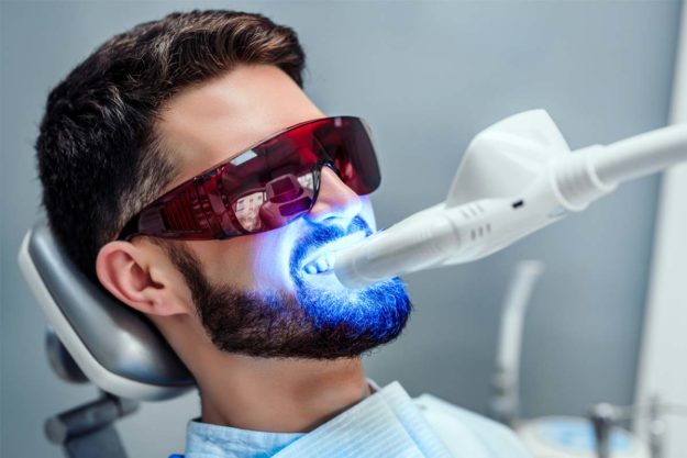 what-is-cosmetic-dentistry man receiving cosmetic dentistry services