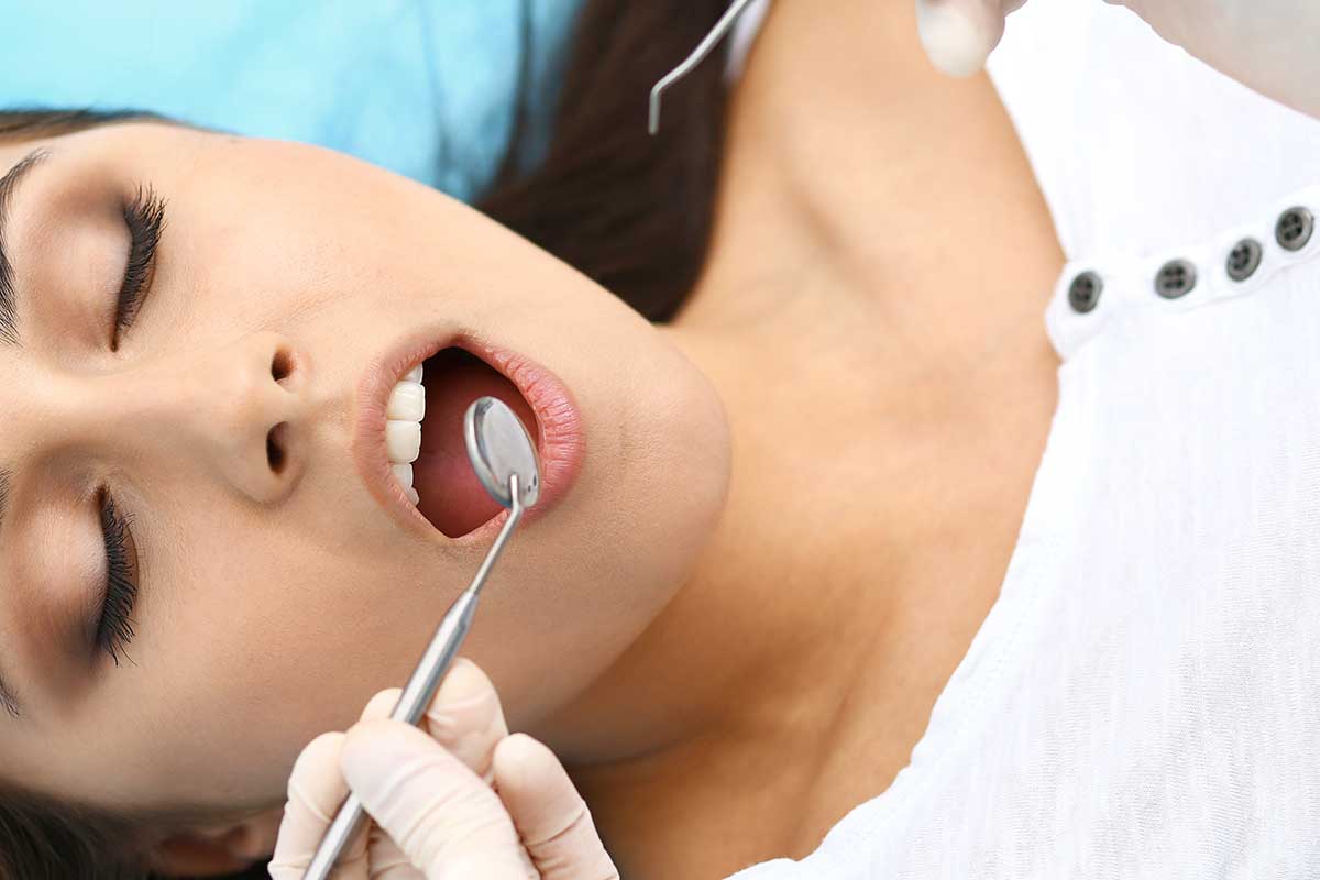 a woman needs emergency dental services