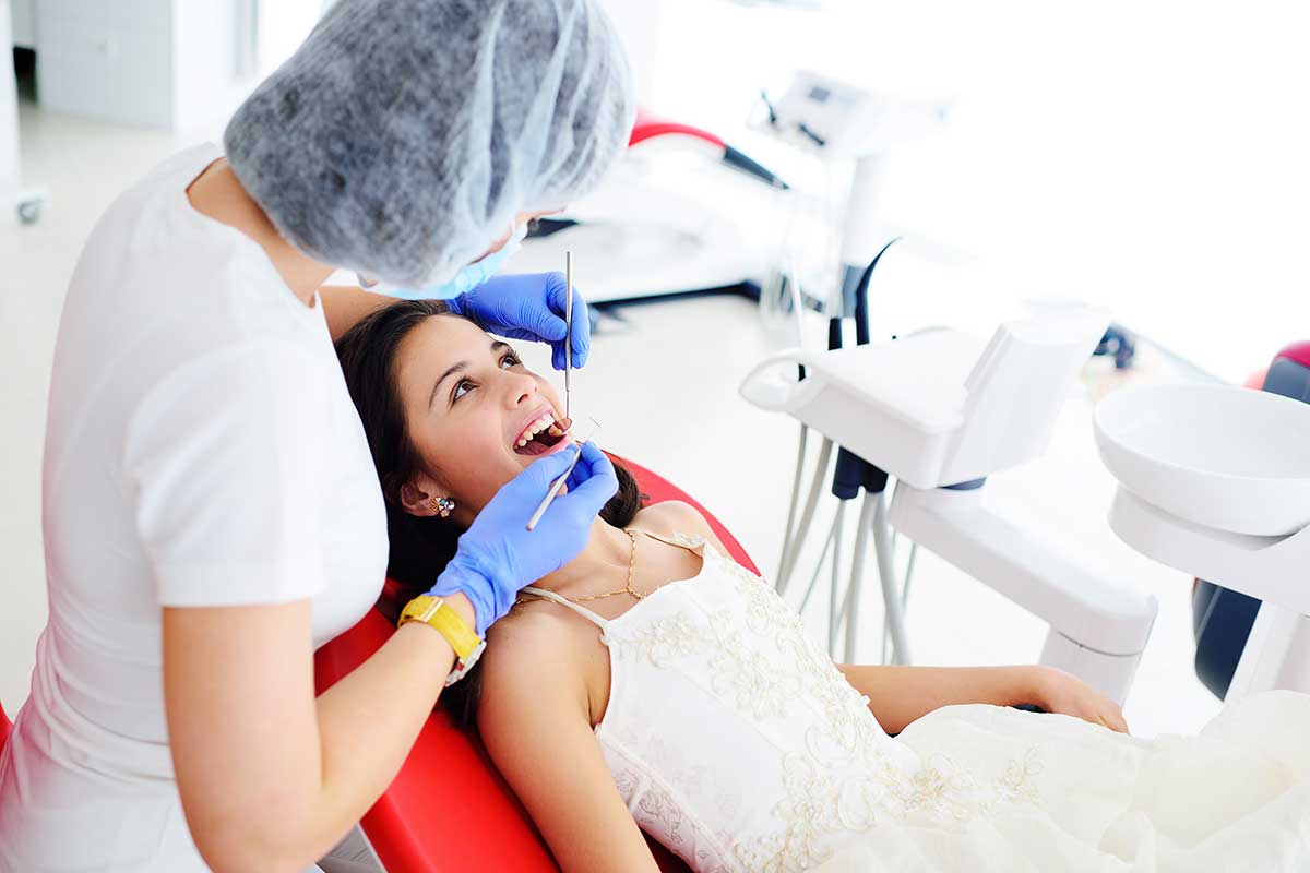 a woman is happy to see her saturday dentist