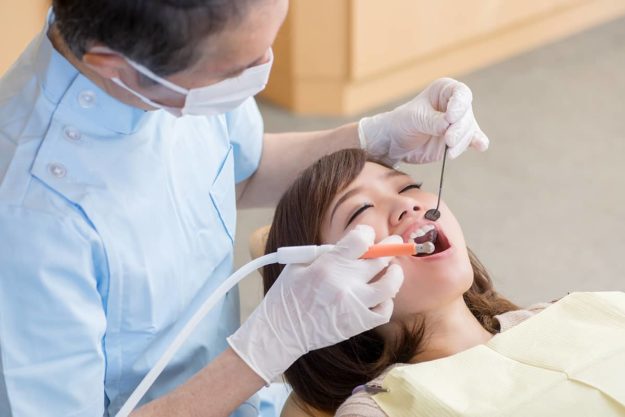 gingivitis treatment (2) Woman being treated for gingivitis treatment.