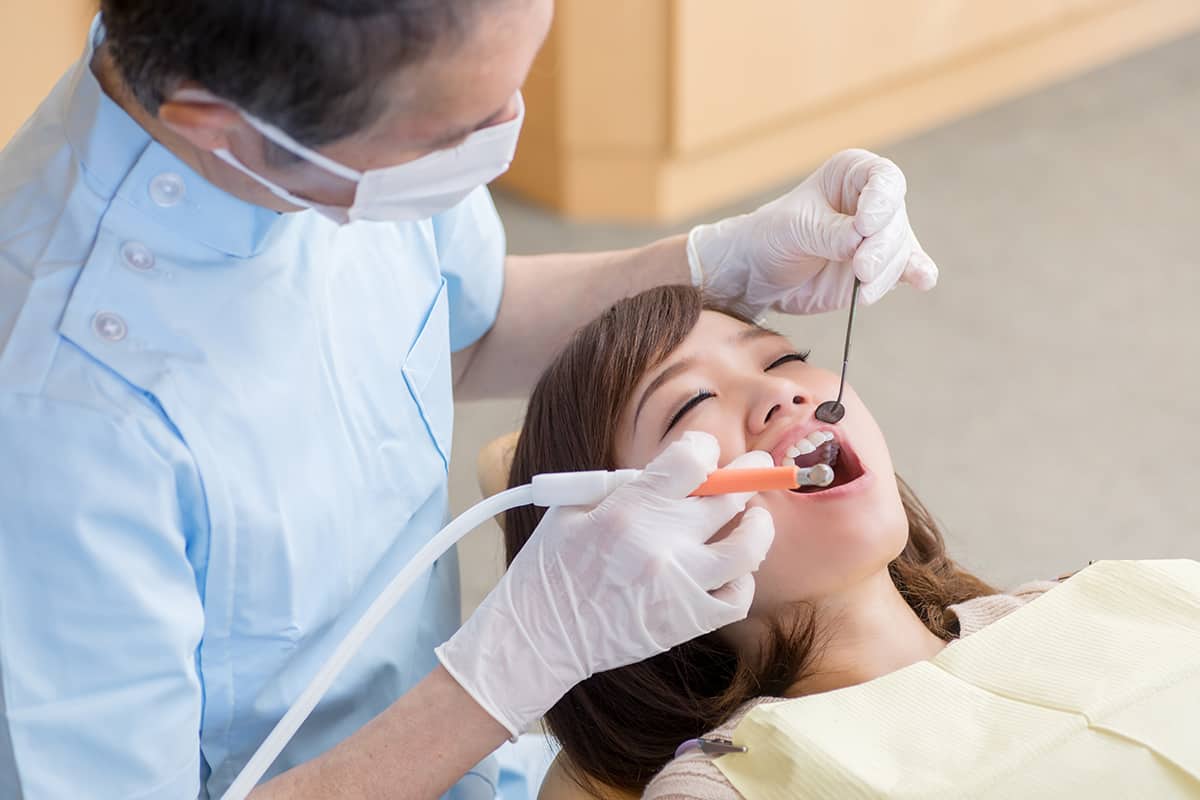 gingivitis treatment (2) Woman being treated for gingivitis treatment.
