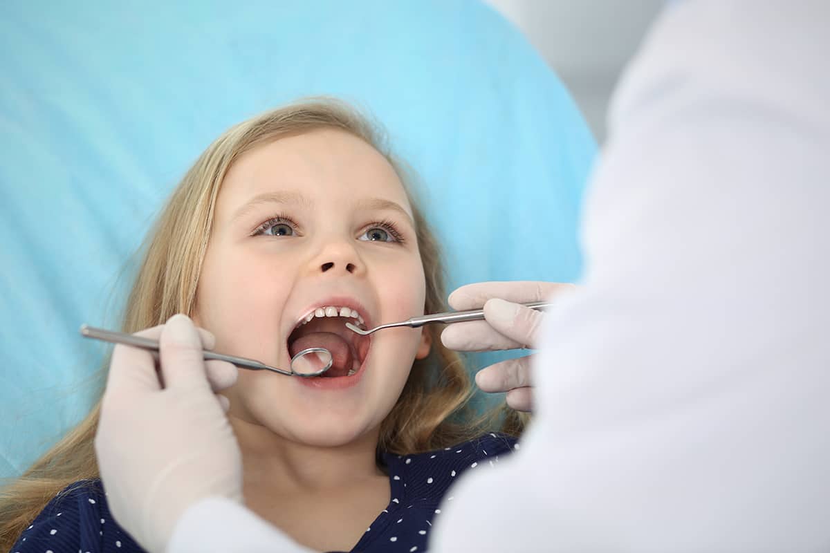 oral health (1) Girl having oral health exam.
