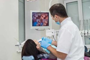 woman receives a dental exam