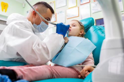 3 Benefits of Braces for Kids a man applies braces for kids